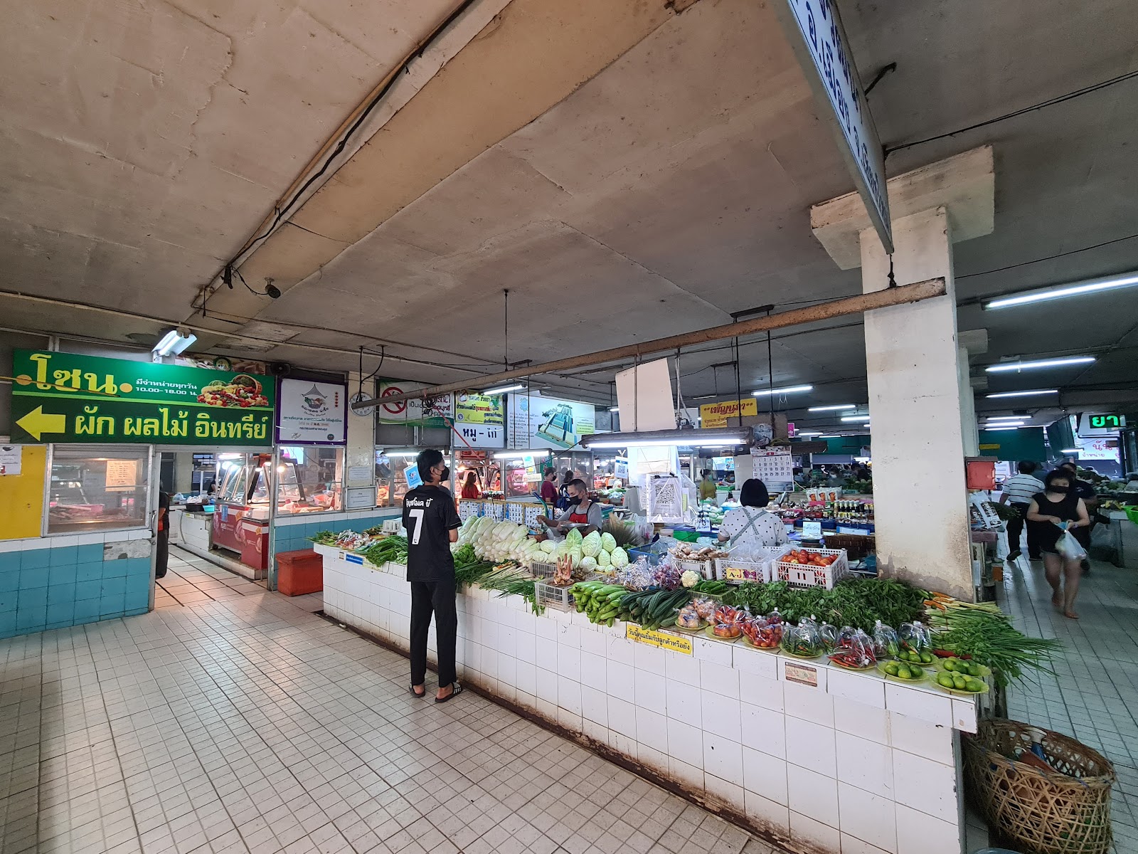 Stalls and produce at Siri Wattana market in Santitham