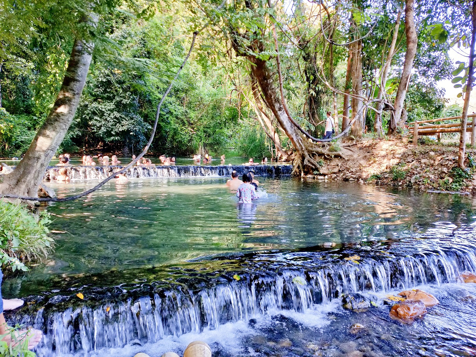 Shaded natural pools at Sai Ngam mineral spring north of Pai