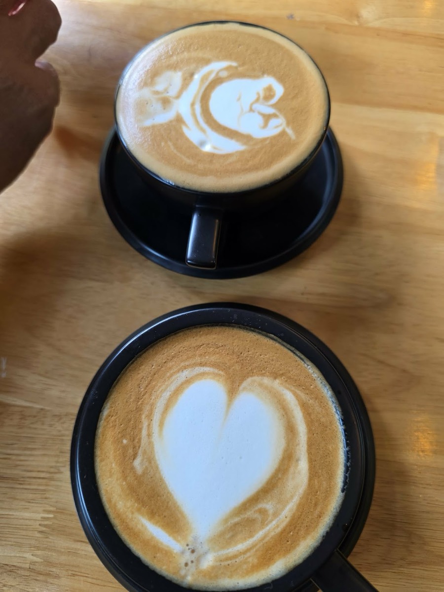 Two flat whites with latte art at Truce Coffee, Railay